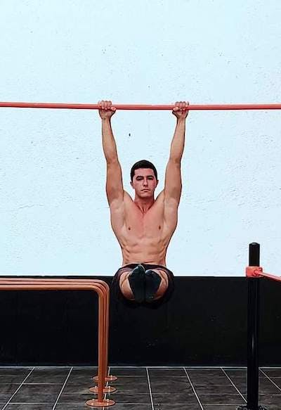 Guy Performing L-sit on Pull Up Bar