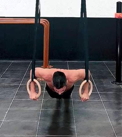 Push ups with rotation on rings