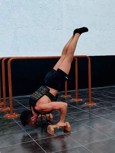 Weighted and assisted handstand push-up