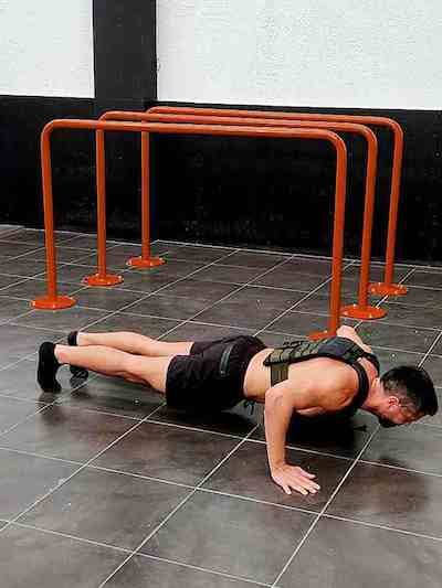 Wide grip weighted push-ups