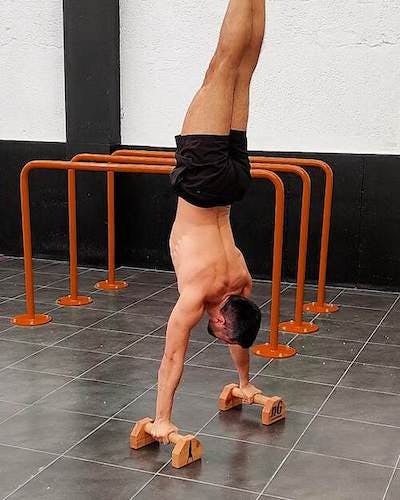 Tucked handstand with flexed arms