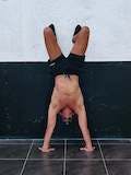 Assisted short handstand push-ups