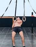 One hand row on rings