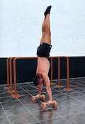 Straight handstand with posterior pelvic tilt